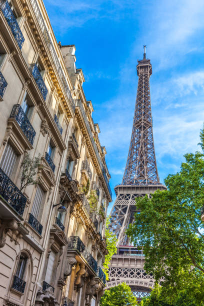 istock Eiffel tower in central Paris between residential old architecture buildings 914965604