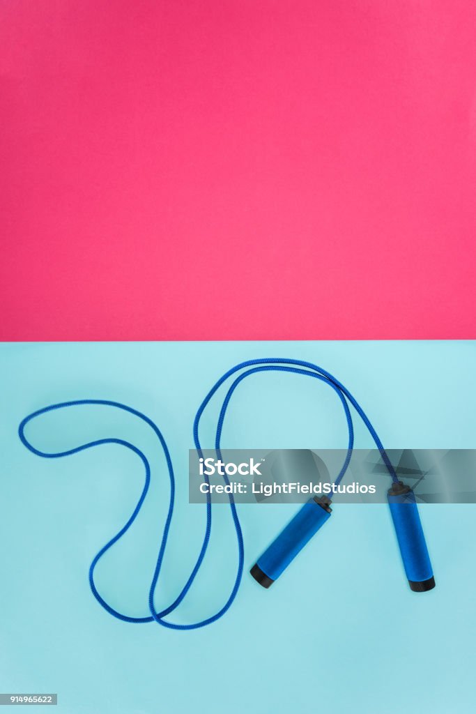 Skipping rope isolated on pink and blue Jump Rope Stock Photo