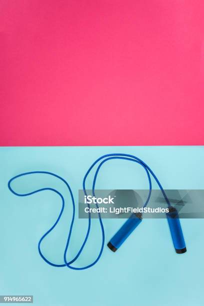 Skipping Rope Isolated On Pink And Blue Stock Photo - Download Image Now - Jump Rope, Agility, Blue