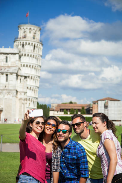 istock Friends visiting Italy - Pisa and the leaning tower 914965934