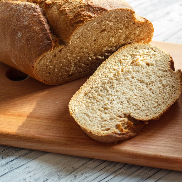 istock On a wooden background rye bread sliced close-up. 914973832