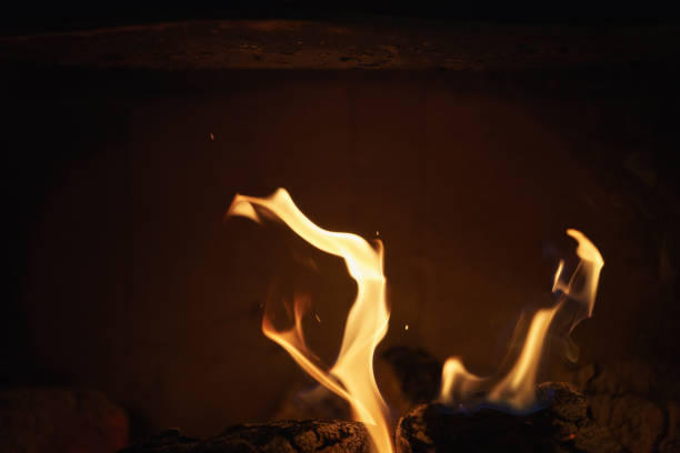 istock close up of charcoal burning in fireplace 914977524