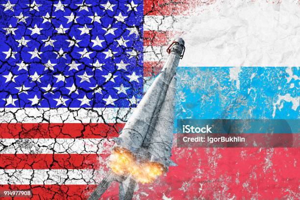 Confrontation Between The Usa And Russia Threat Of Nuclear Strike The Flags Of Two Countries Painted On The Concrete Wall Arms Race Difficult Relationship Stock Photo - Download Image Now