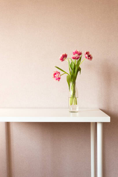 istock Bouquet of tulips on white table. Work space. 914982490