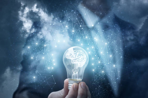 istock Man shows the lamp with the brain in the sky. 914983322