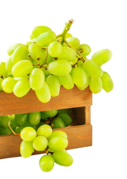 istock Fresh grapes in the wooden box isolated on white background 914998318