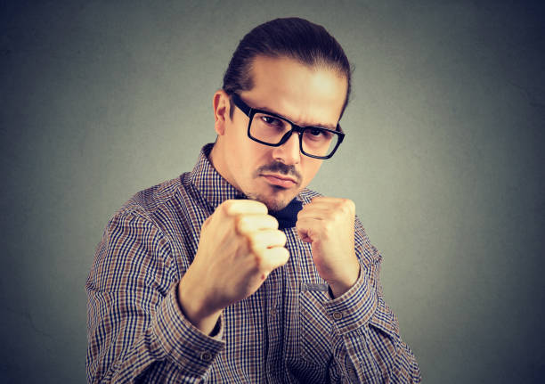 istock Aggressive man threatening with fist 914999626