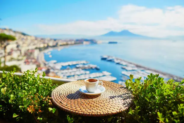 Photo of Cup of coffee with view on Vesuvius mount in Naples