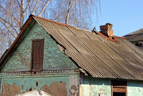 istock Ruined house with a holey slate roof 915001850