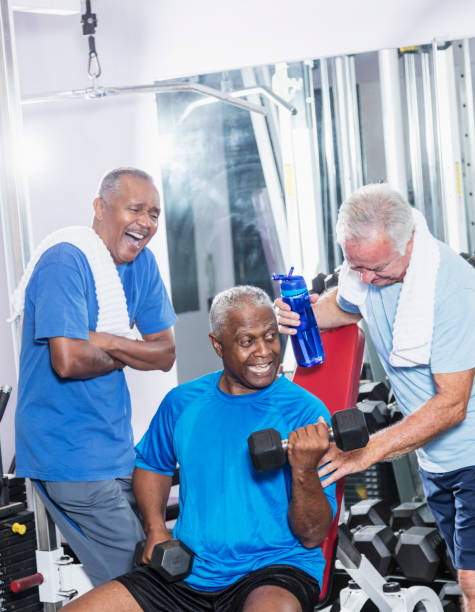 istock Three senior multi-ethnic men working out at gym talking 915002796