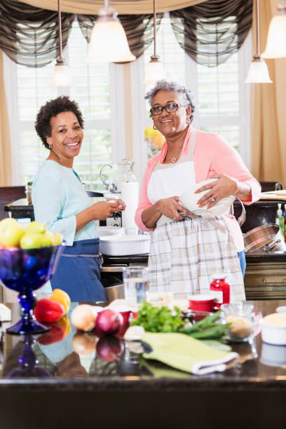 istock African-American women in kitchen cooking 915005442