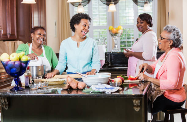 istock African-American women in kitchen cooking 915005750