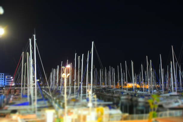 istock Yacht pier at night 915005898