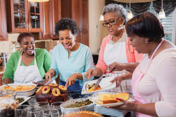 istock African-American women serving home cooked meal 915008886