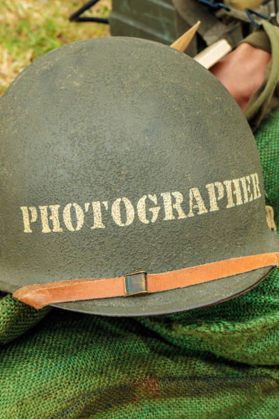 istock Old helmet of a war photographer 915010254
