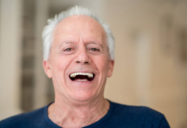 istock Beautiful senior man laughing and looking at the camera 915010522