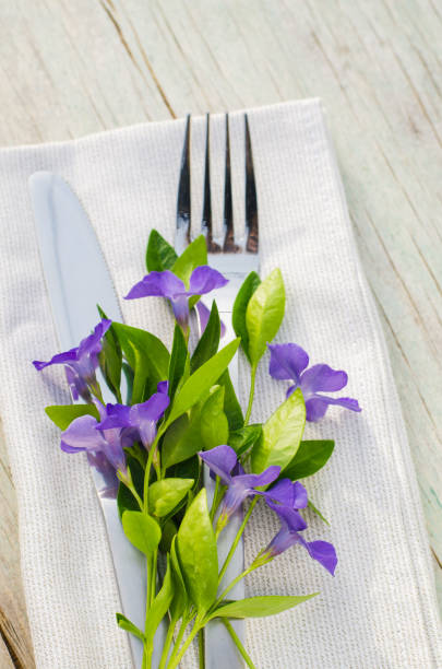 istock Festive Table setting with purple flowers. 915017170