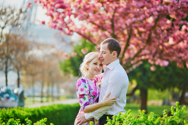 istock Couple near the Eiffel tower on spring day in Paris 915018242