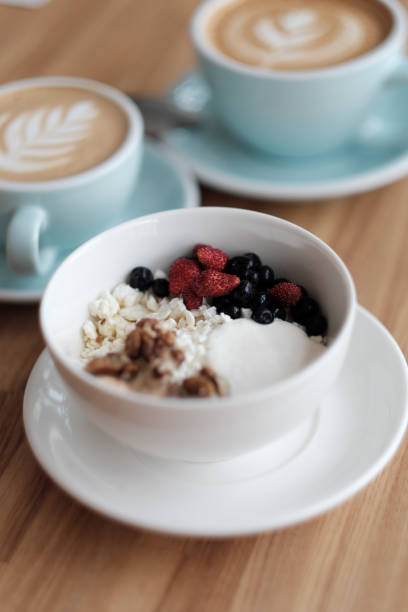 istock Breakfast. Cottage cheese with fresh berries and nuts, and coffee 915020552