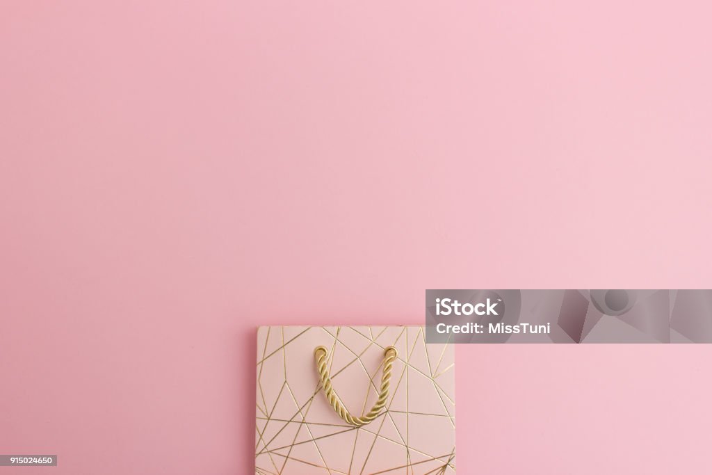 Elegant gift bag in pink with space for text Elegant pink gift bag with gold pattern space for text Shopping Bag Stock Photo