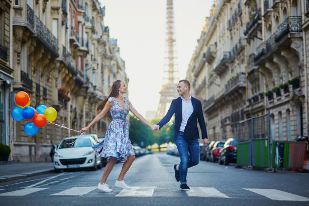 istock Romantic couple near the Eiffel tower in Paris 915028430