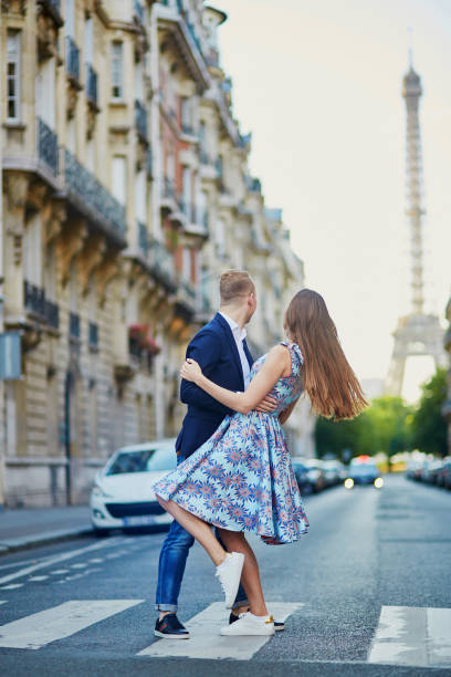 istock Romantic couple near the Eiffel tower in Paris 915028488