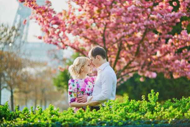 istock Couple near the Eiffel tower on spring day in Paris 915028672