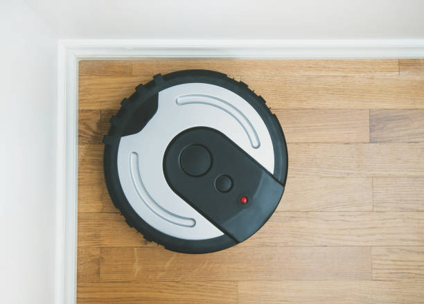 istock Black robotic vacuum cleaner. Space for your text. 915032738