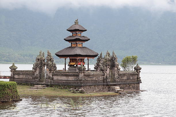 Island shrine, Pura Ulun Danu Bratan Temple, Bali  floating temple in lake bedugul bali stock pictures, royalty-free photos & images