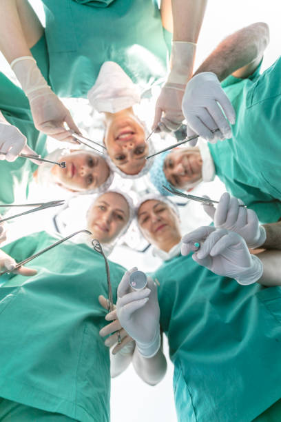 istock Team of nurses and surgeons in surgery 915037188