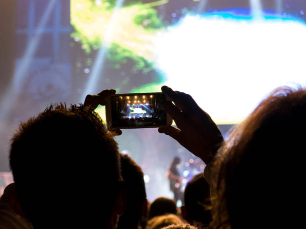 istock Concert crowd filming with mobile phones 915037986