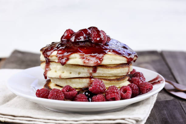istock Pancakes with Fresh Rasperries and Raspberry Sauce 915041486