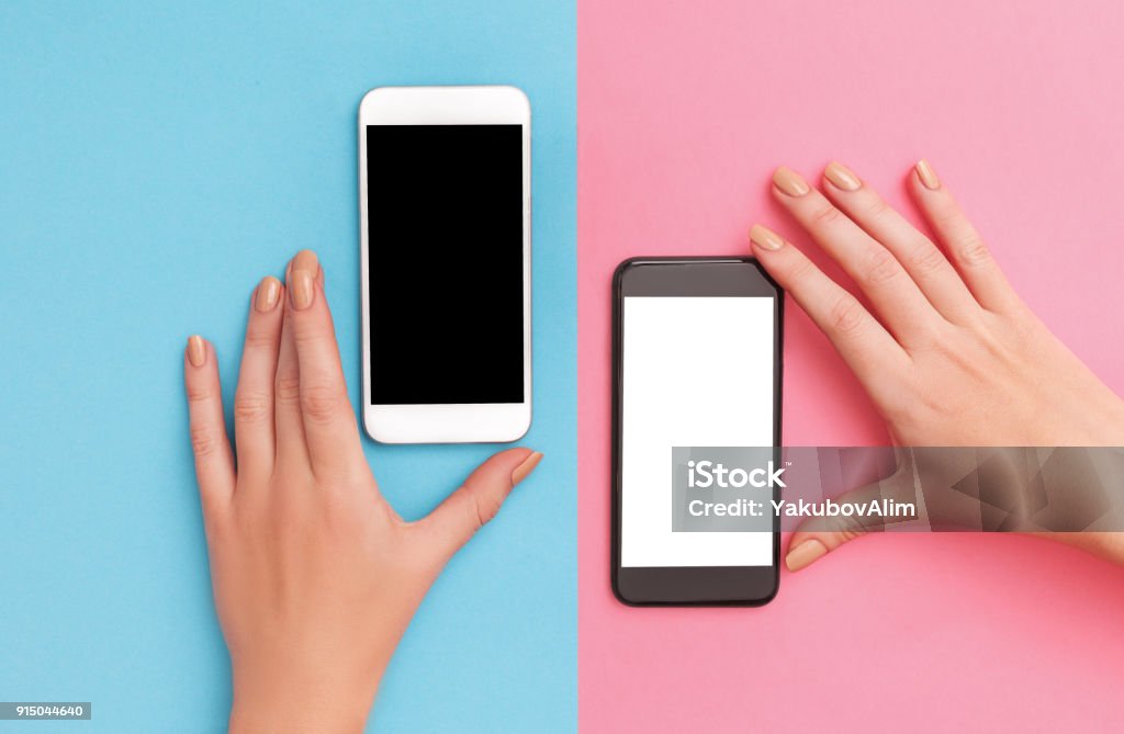 female hands hold two phones black and white Two People Stock Photo