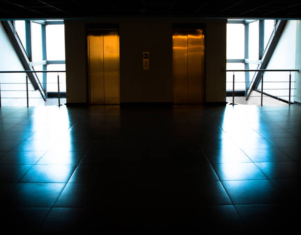 istock Glass wall with door to elevators in office building 915044798