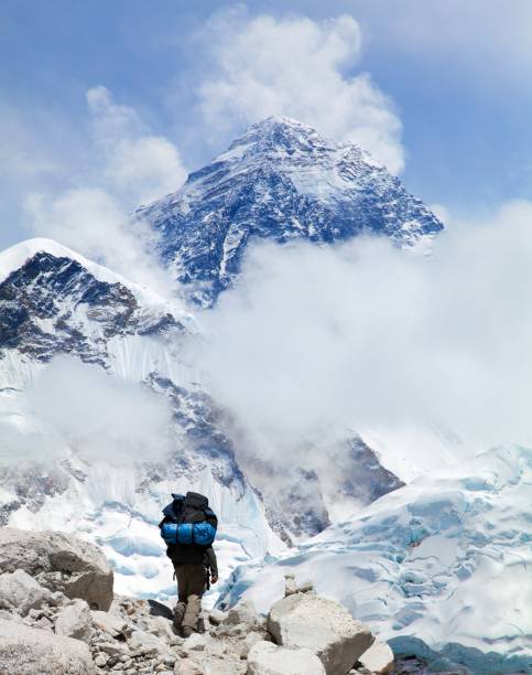 Mount Everest from Kala Patthar and tourist with ice axe