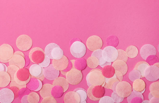 istock Pink confetti on pastel pink background. Festive background  for your design. 915045072