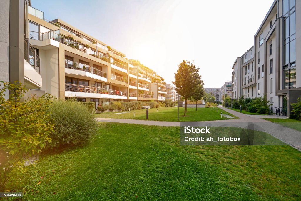 Modern apartment buildings in a green residential area in the city Apartment Stock Photo