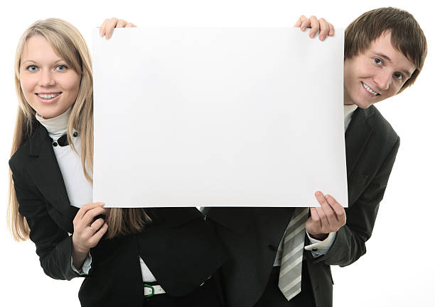 istock Two young people holding a white sign 91505156