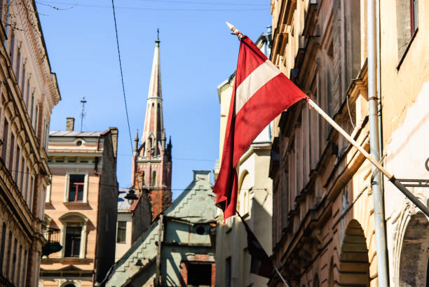 Riga old town with Latvian flag - independence celebration, Riga, Latvia