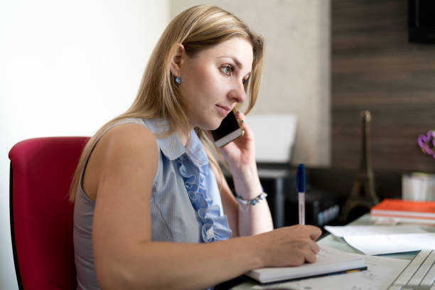 istock Young woman working in home office 915056884