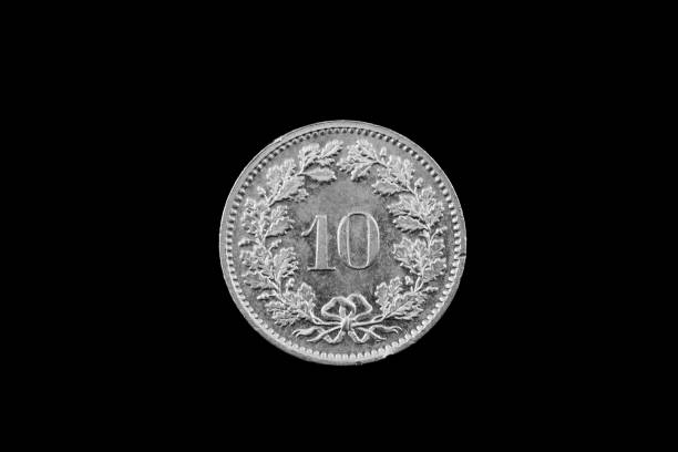 istock Swiss Ten Centimes Coin Isolated On Black 915056998