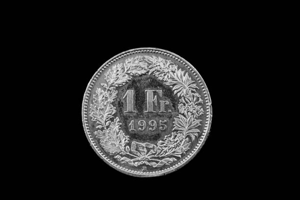 istock Swiss One Franc Coin Isolated On A Black Background 915059026