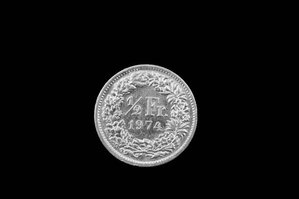 istock Swiss Half Franc Coin Isolated On A Black Background 915059036