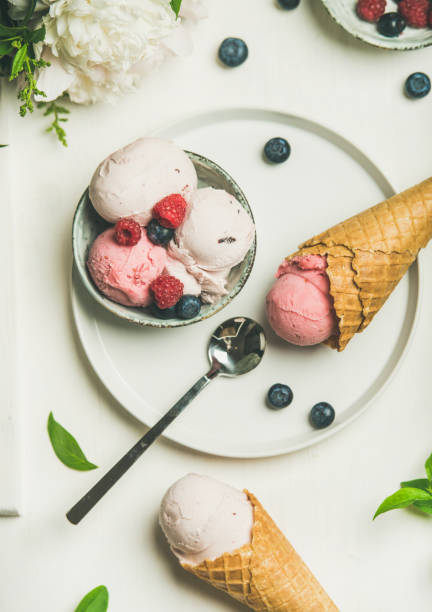 istock Pink strawberry and coconut ice cream scoops, top view 915059354