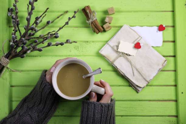 istock Girl drinking hot coffee and looks presented valentines 915060446