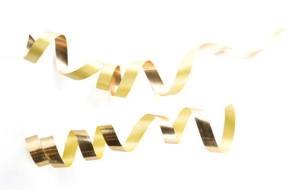istock Golden ribbon roll isolated on white background 915062700