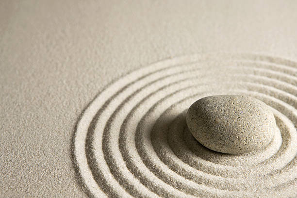 istock Image of a zen stone in circles of sand 91506445