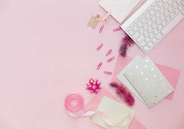 istock Flat lay, luxury feminine desk workspace on pink background. 915067472