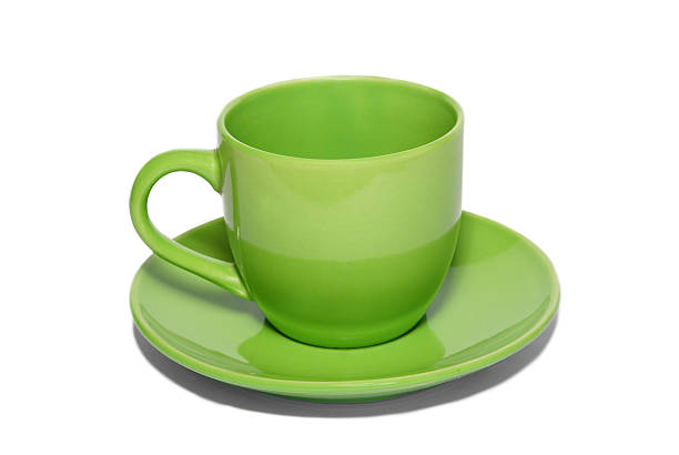 istock Green ceramic cup and saucer isolated on white. 91507023
