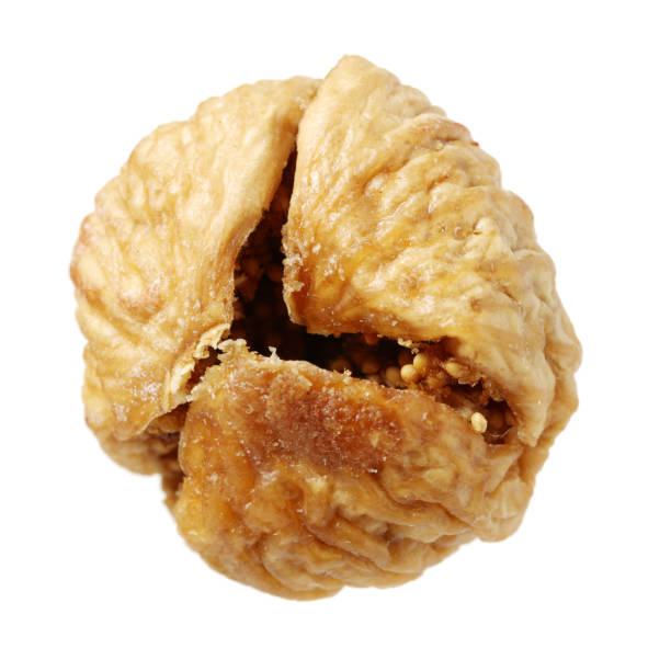 istock Dried figs with one chopped in half isolated on white 915070642